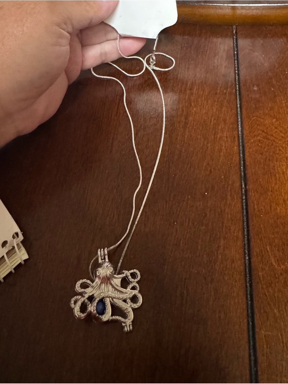 octopus pendant with a blue pearl
